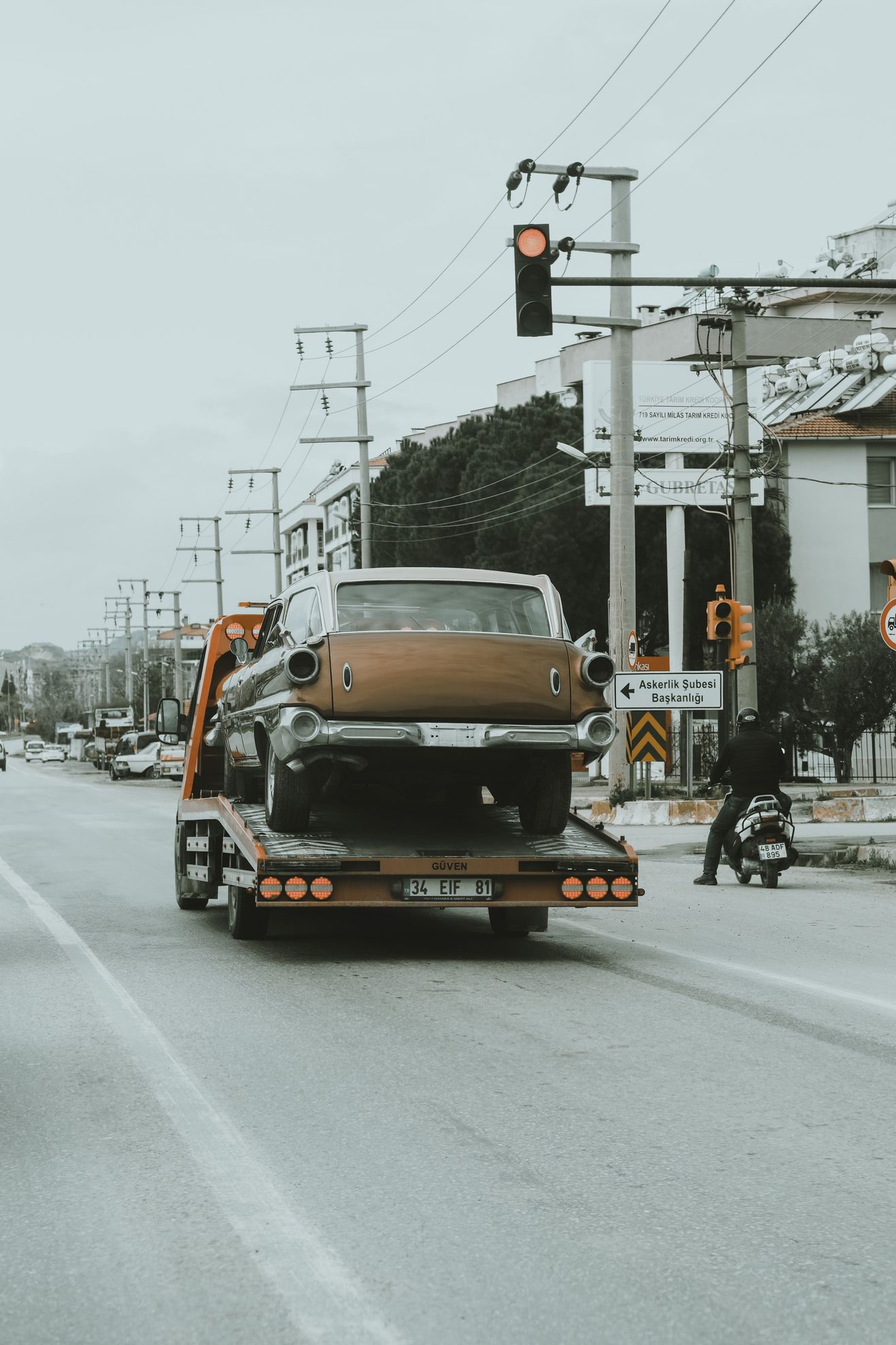 Vehicle receiving roadside assistance on a scenic road